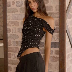 A typical one-shoulder top - black with polka dots