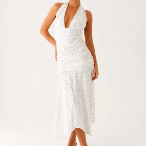 Grettana halter neck midi dress in white with polka dots.