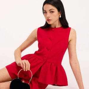 Set of sleeveless top with peplum and shorts.