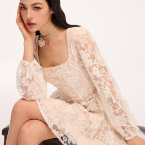 Semi-sheer mini dress with floral lace and square neckline.