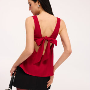 Sleeveless top with open back and bow